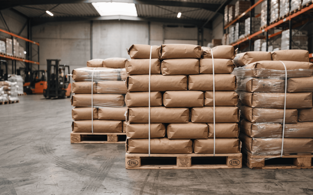 Bulk garlic packed in export ready kraft paper bags on pallets for international shipping