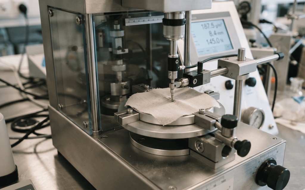 Fabric quality testing including GSM verification before bulk apparel manufacturing